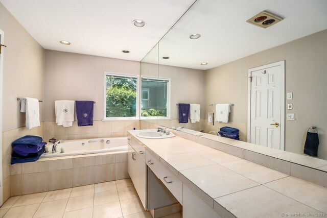 230 New Canaan Ave Apt 2, Norwalk, CT 06850 - bathroom featuring a garden tub, tile patterned flooring, double vanity, and recessed lighting