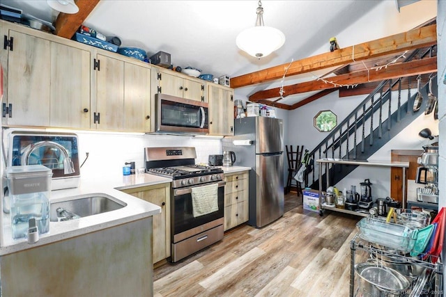 206 Litchfield Tpke, Washington, CT 06777 - kitchen featuring appliances with stainless steel finishes, backsplash, light wood-style flooring, light brown cabinetry, and pendant lighting