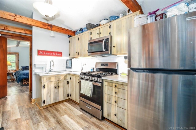 206 Litchfield Tpke, Washington, CT 06777 - kitchen with appliances with stainless steel finishes, a sink, beam ceiling, light countertops, and decorative backsplash