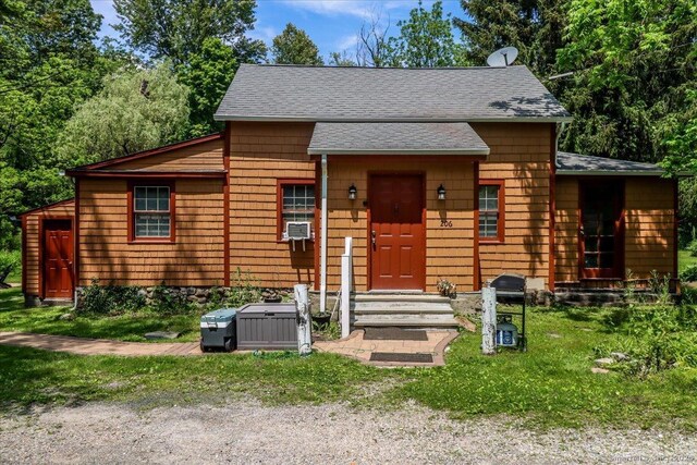 206 Litchfield Tpke, Washington, CT 06777 - view of front of house featuring roof with shingles and cooling unit