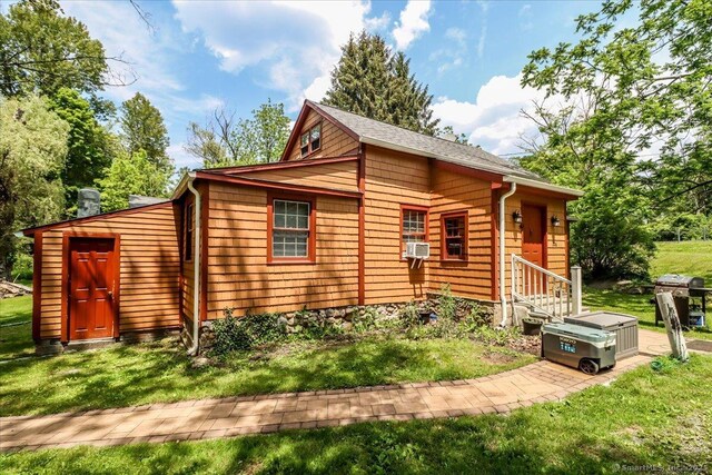 206 Litchfield Tpke, Washington, CT 06777 - view of side of property with entry steps, a yard, and cooling unit