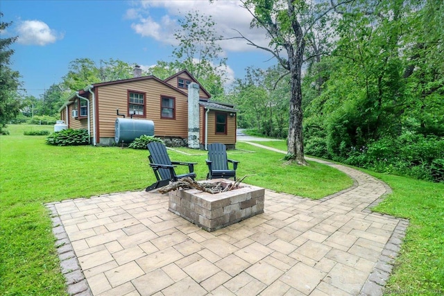206 Litchfield Tpke, Washington, CT 06777 - view of patio with oil tank and a fire pit