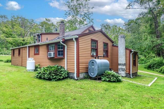 206 Litchfield Tpke, Washington, CT 06777 - view of side of home featuring a chimney, oil tank, a yard, and cooling unit