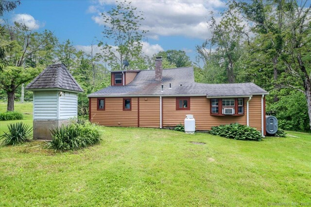 206 Litchfield Tpke, Washington, CT 06777 - rear view of house with a yard and a chimney