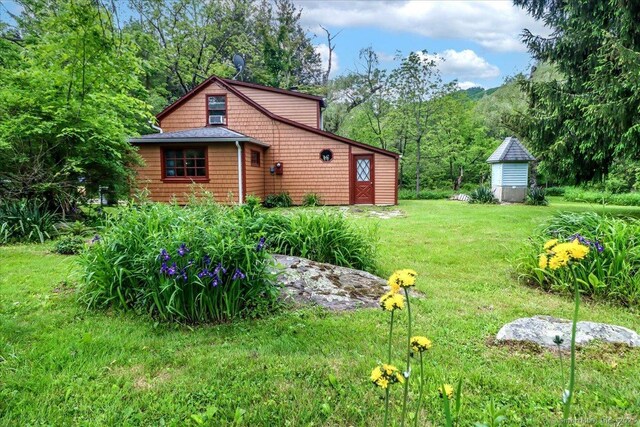 206 Litchfield Tpke, Washington, CT 06777 - view of home's exterior featuring a yard