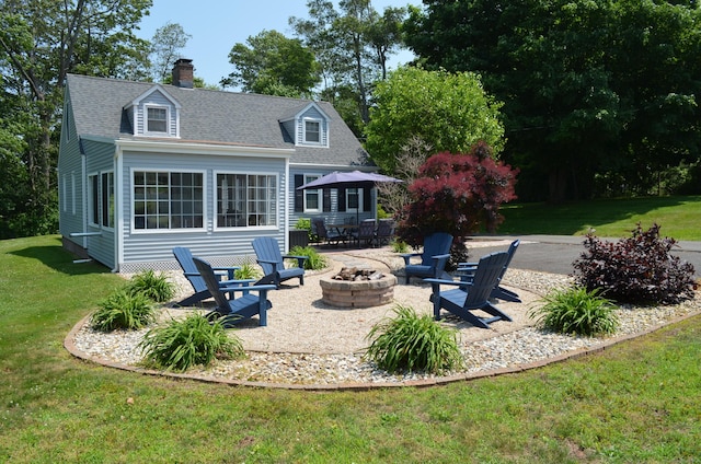 55 Cloudland Rd, North Haven, CT 06473 - back of house featuring an outdoor fire pit, a yard, a patio area, a chimney, and roof with shingles