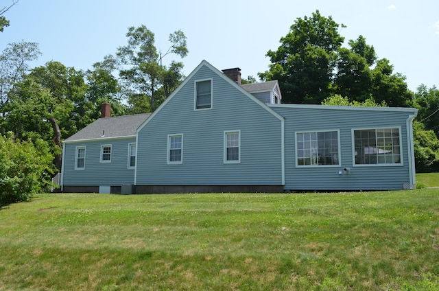 55 Cloudland Rd, North Haven, CT 06473 - rear view of property with a chimney, a yard, and a shingled roof
