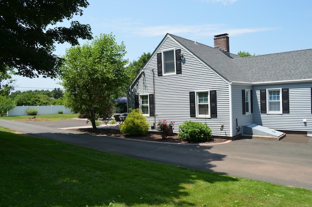55 Cloudland Rd, North Haven, CT 06473 - view of property exterior with a chimney and a shingled roof