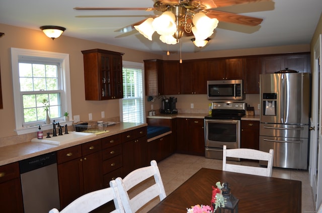 55 Cloudland Rd, North Haven, CT 06473 - kitchen featuring appliances with stainless steel finishes, light countertops, a ceiling fan, and light tile patterned floors