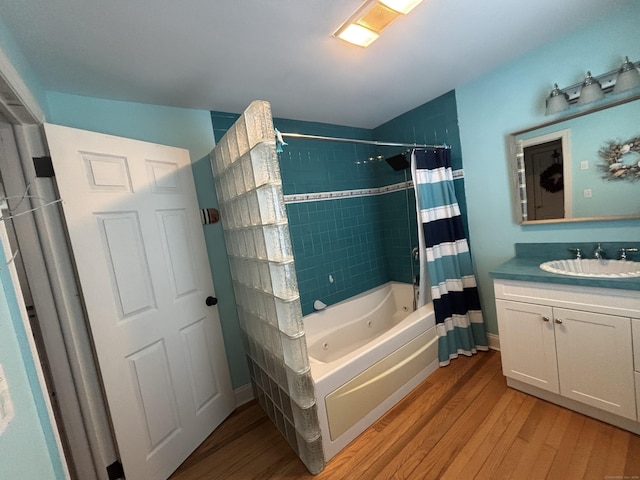55 Cloudland Rd, North Haven, CT 06473 - bathroom with wood finished floors, a combined bath / shower with jetted tub, and vanity