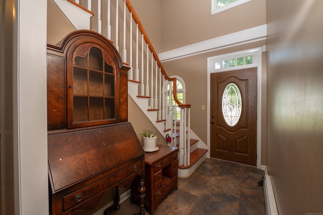 791 Ives Row, Cheshire, CT 06410 - foyer entrance featuring a high ceiling, stairway, stone finish flooring, baseboards, and a baseboard radiator
