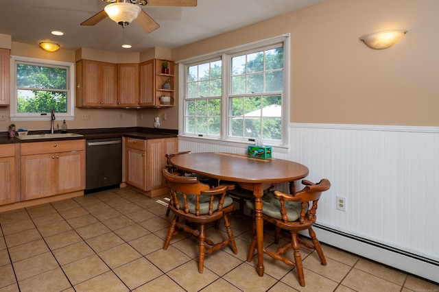 791 Ives Row, Cheshire, CT 06410 - kitchen with stainless steel dishwasher, a sink, wainscoting, light tile patterned flooring, and dark countertops