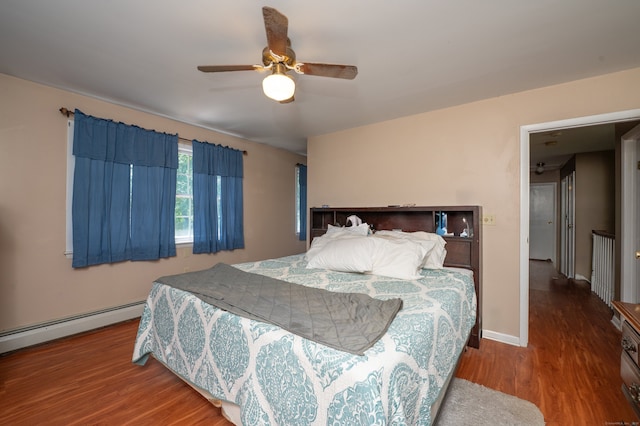 791 Ives Row, Cheshire, CT 06410 - bedroom featuring wood finished floors, a baseboard heating unit, baseboards, and a ceiling fan