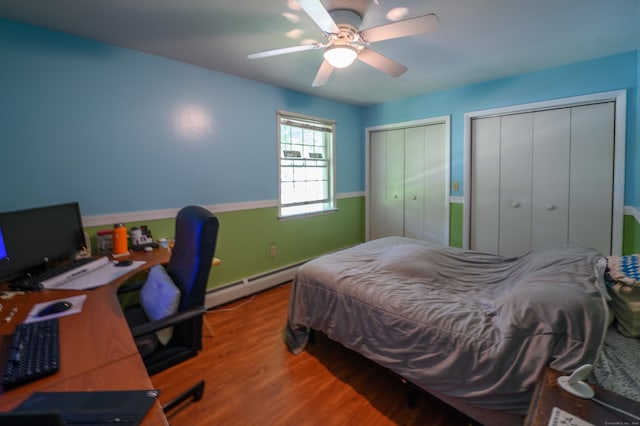 791 Ives Row, Cheshire, CT 06410 - bedroom featuring multiple closets, wood finished floors, baseboard heating, and a ceiling fan