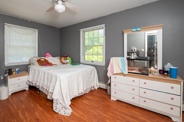 791 Ives Row, Cheshire, CT 06410 - bedroom with wood finished floors, a baseboard radiator, baseboards, and ceiling fan