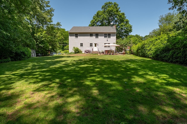 791 Ives Row, Cheshire, CT 06410 - rear view of house featuring a lawn and a chimney