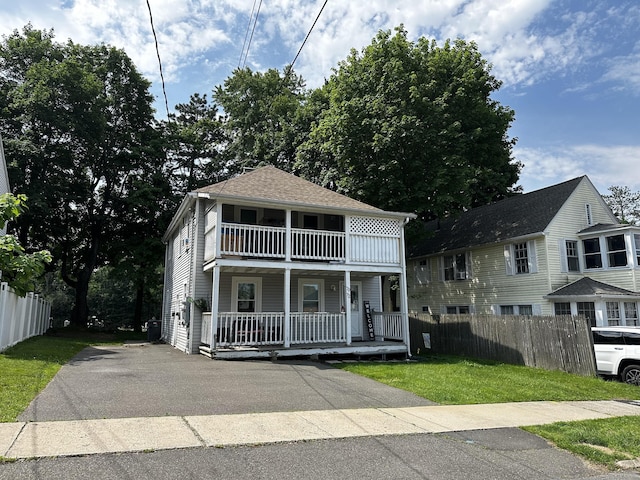 72 Beech St, Bristol, CT 06010 - view of front of house with a porch, a balcony, and asphalt driveway
