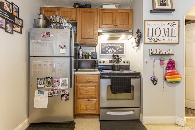 72 Beech St, Bristol, CT 06010 - kitchen featuring stainless steel appliances, brown cabinets, under cabinet range hood, and light countertops