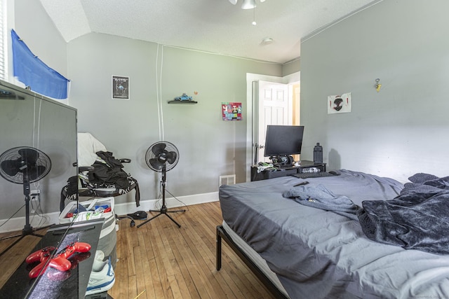 72 Beech St, Bristol, CT 06010 - bedroom with hardwood / wood-style flooring, vaulted ceiling, and a ceiling fan