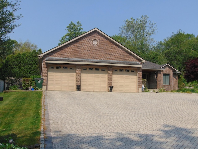4 Florence Dr, Prospect, CT 06712 - view of front of home with a garage, brick siding, driveway, and a front yard