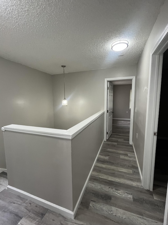 20 Cossett St, Waterbury, CT 06704 - hall with an upstairs landing, a textured ceiling, and wood finished floors