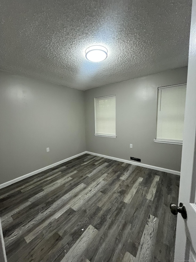 20 Cossett St, Waterbury, CT 06704 - unfurnished room with a textured ceiling and wood finished floors