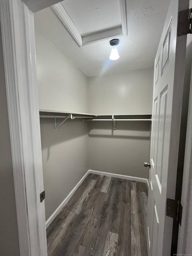 20 Cossett St, Waterbury, CT 06704 - spacious closet featuring dark wood-style floors and attic access