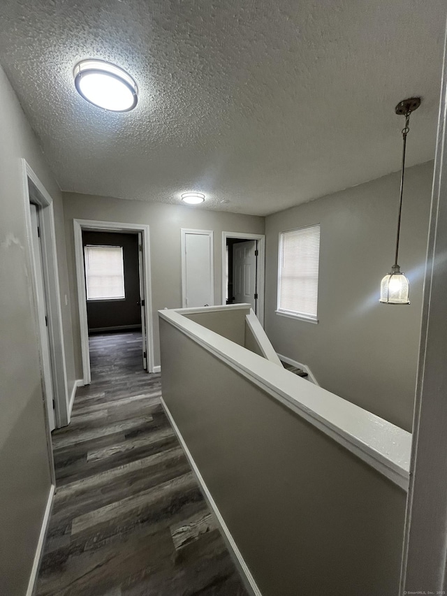 20 Cossett St, Waterbury, CT 06704 - corridor featuring a textured ceiling and dark wood-style flooring