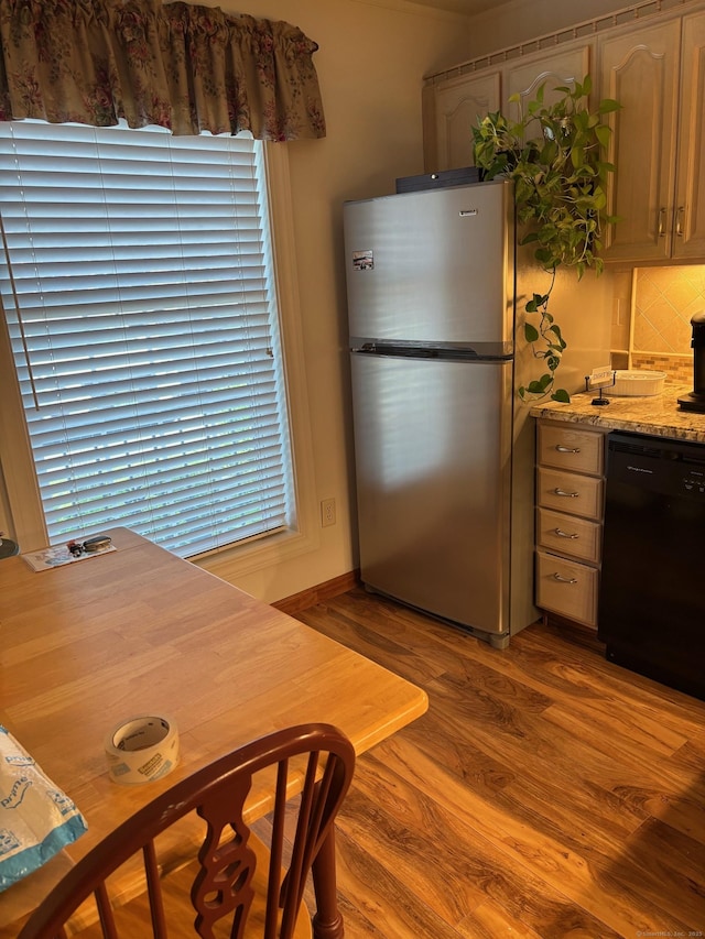 42 Salem Walk Unit 42, Milford, CT 06460 - kitchen featuring freestanding refrigerator, dishwasher, wood finished floors, and decorative backsplash