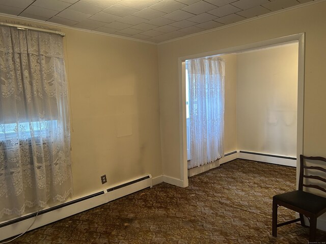 48 Anderson St, Naugatuck, CT 06770 - spare room featuring baseboard heating and crown molding