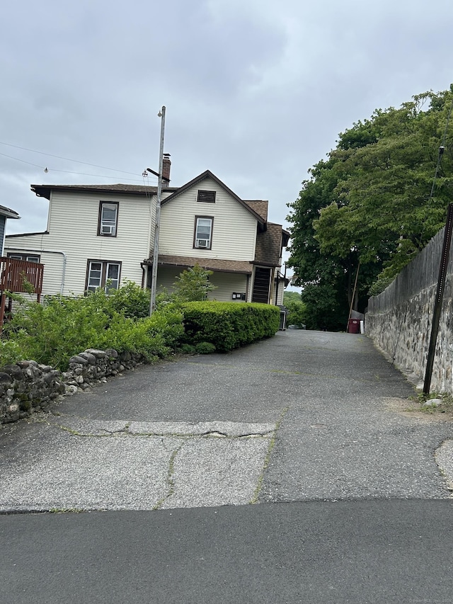 48 Anderson St, Naugatuck, CT 06770 - view of property exterior featuring a chimney