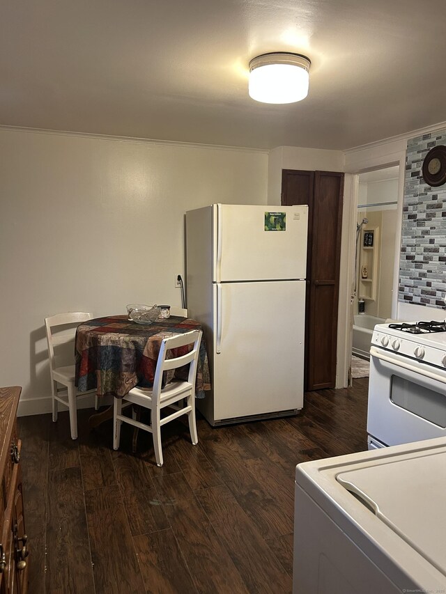 48 Anderson St, Naugatuck, CT 06770 - kitchen featuring white appliances, dark wood-style floors, washer / dryer, and dark brown cabinetry