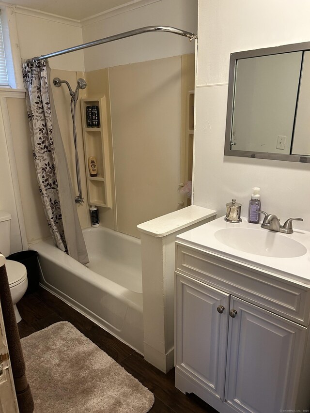 48 Anderson St, Naugatuck, CT 06770 - bathroom featuring toilet, wood finished floors, vanity, shower / tub combo with curtain, and ornamental molding