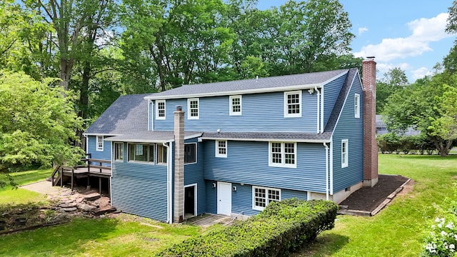 890 Copper Hill Rd, Suffield, CT 06093 - rear view of property featuring a chimney, a yard, a deck, a shingled roof, and view of wooded area