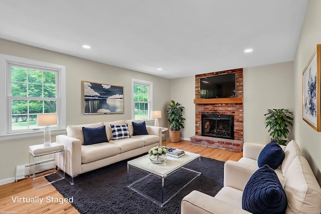 890 Copper Hill Rd, Suffield, CT 06093 - living area featuring wood finished floors, baseboard heating, a fireplace, and recessed lighting