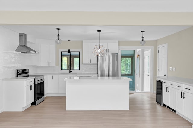 890 Copper Hill Rd, Suffield, CT 06093 - kitchen with stainless steel appliances, extractor fan, wine cooler, backsplash, and light wood-style flooring