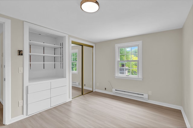 890 Copper Hill Rd, Suffield, CT 06093 - unfurnished bedroom with a baseboard radiator, wood finished floors, and a closet