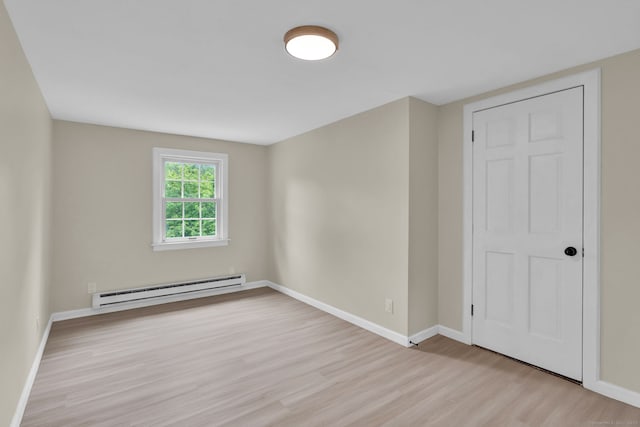 890 Copper Hill Rd, Suffield, CT 06093 - spare room featuring a baseboard radiator and wood finished floors