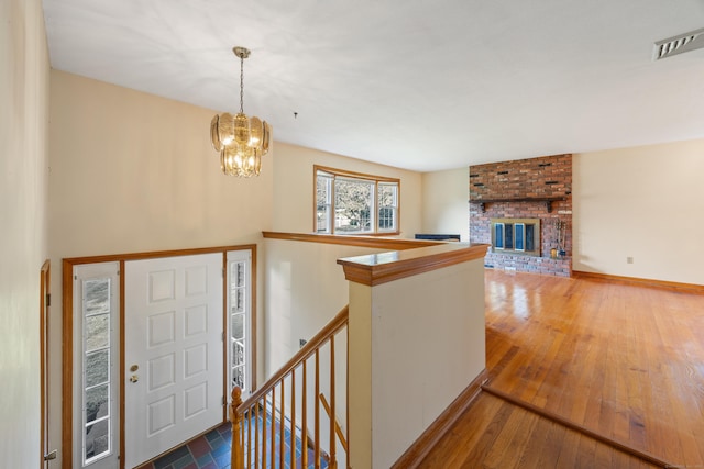 10 Longview Ln, Wallingford, CT 06492 - foyer featuring a chandelier, wood-type flooring, and baseboards