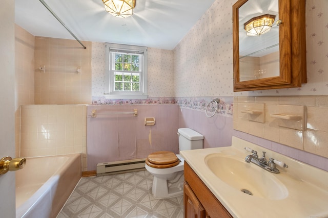 10 Longview Ln, Wallingford, CT 06492 - full bathroom featuring a baseboard heating unit, toilet, vanity, wainscoting, and wallpapered walls