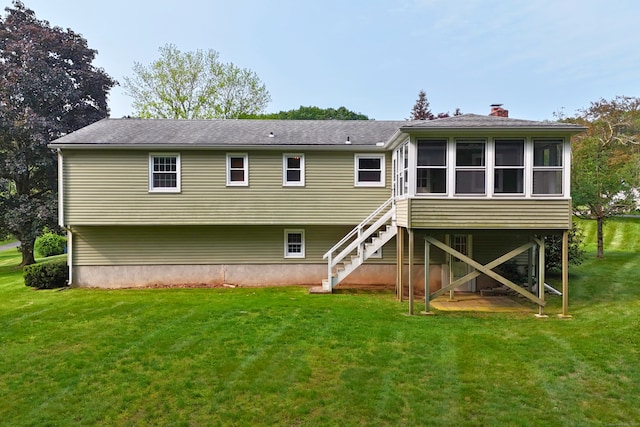 10 Longview Ln, Wallingford, CT 06492 - back of house featuring a sunroom, stairway, a chimney, and a yard