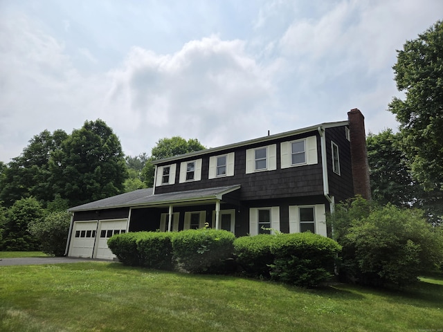 7 Michael Rd, Simsbury, CT 06070 - view of front of home featuring a chimney, a garage, a front yard, and asphalt driveway