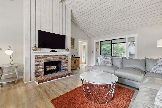 646 Onondaga Ln Unit B, Stratford, CT 06614 - living area featuring light wood finished floors, baseboards, a fireplace, wood ceiling, and high vaulted ceiling