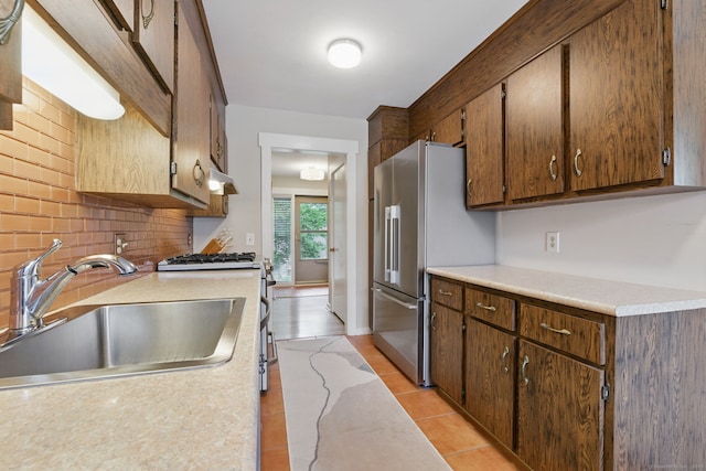 646 Onondaga Ln Unit B, Stratford, CT 06614 - kitchen featuring a sink, appliances with stainless steel finishes, tasteful backsplash, light countertops, and light tile patterned flooring