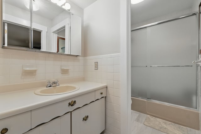 646 Onondaga Ln Unit B, Stratford, CT 06614 - bathroom with combined bath / shower with glass door, vanity, and tile walls