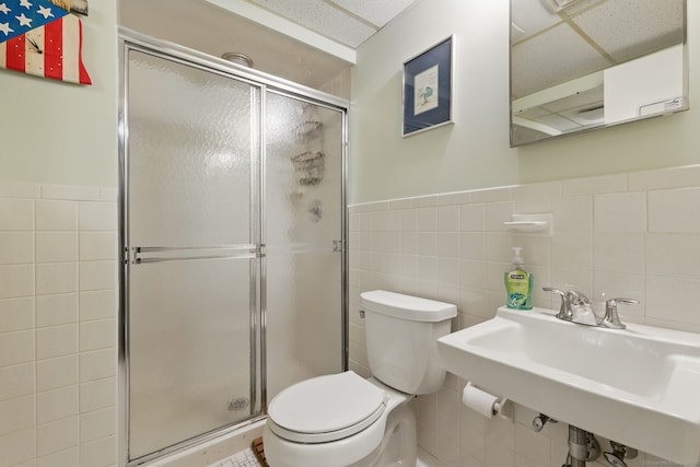 646 Onondaga Ln Unit B, Stratford, CT 06614 - bathroom with tile walls, toilet, a shower stall, a sink, and wainscoting
