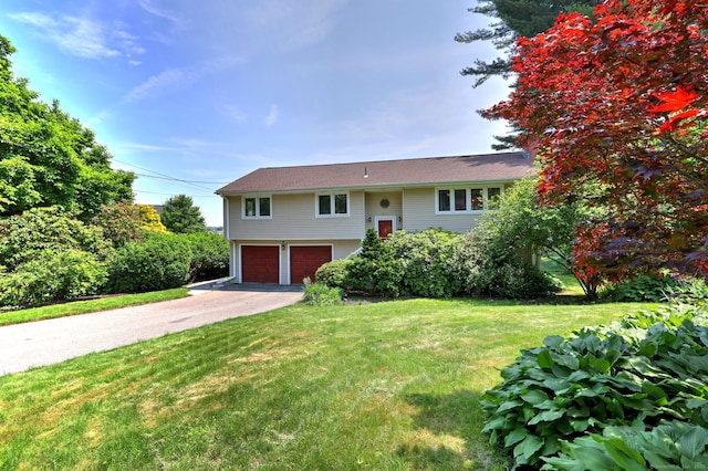17 Farmstead Ln, West Hartford, CT 06117 - bi-level home featuring a garage, asphalt driveway, and a front lawn