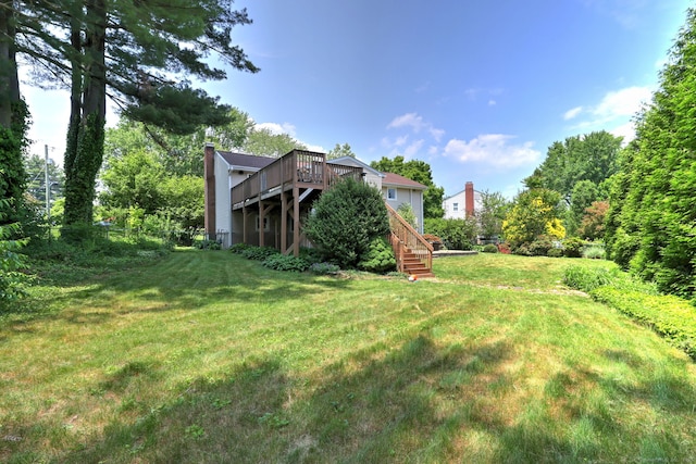 17 Farmstead Ln, West Hartford, CT 06117 - view of green lawn with stairway and a deck