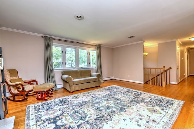17 Farmstead Ln, West Hartford, CT 06117 - living area featuring crown molding, a baseboard heating unit, baseboard heating, wood finished floors, and baseboards