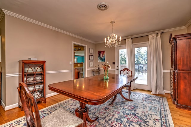 17 Farmstead Ln, West Hartford, CT 06117 - dining space featuring a chandelier, light wood-style floors, ornamental molding, and baseboards